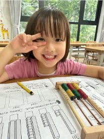 A girl making a peace sign
