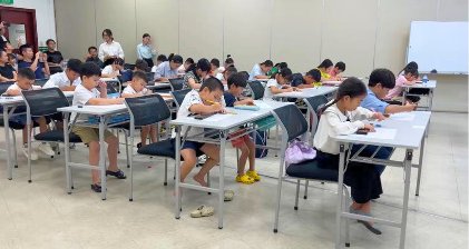 Children solving problems at the contest
