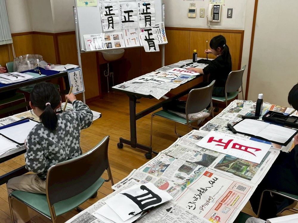 A calligraphy class in progress