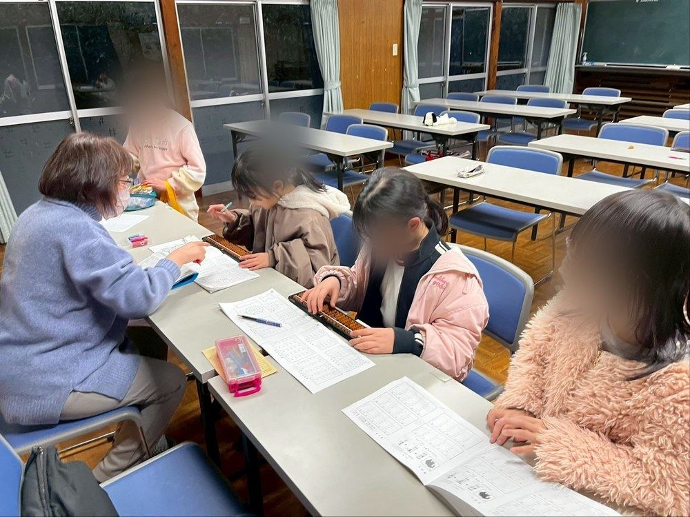 Children working on soroban